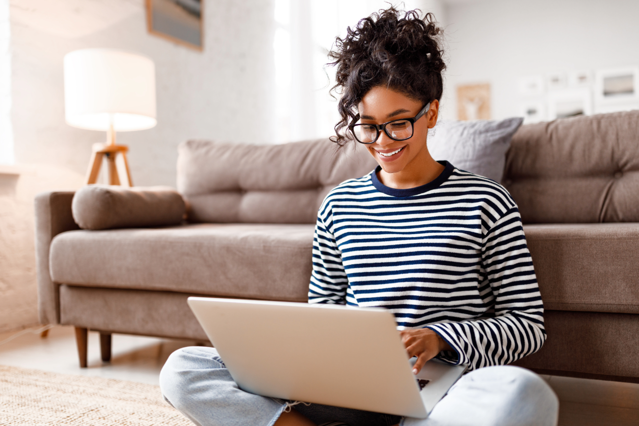 woman on laptop in her living room