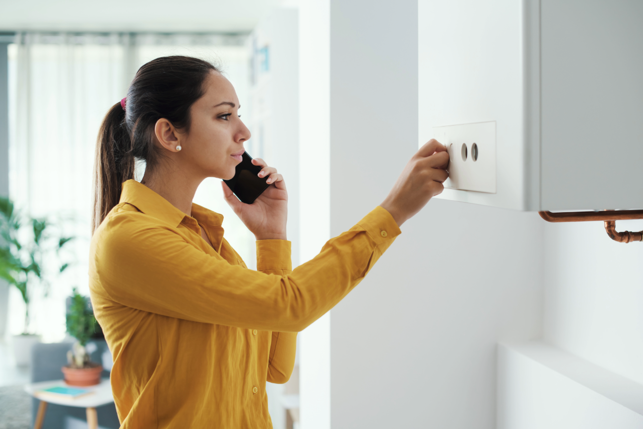woman checking boiler
